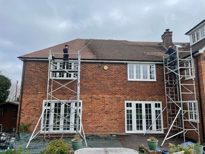 Roof cleaning carried out safely from scaffold towers by The Roof Moss Cleaners in Milton Keynes